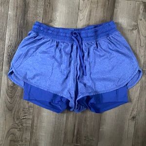 Champion size Small running short. Blue. Spandex under short. Lightly worn.